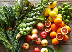 a group of fruits and vegetables on a wood surface Healthy Weight Loss Diets Soham