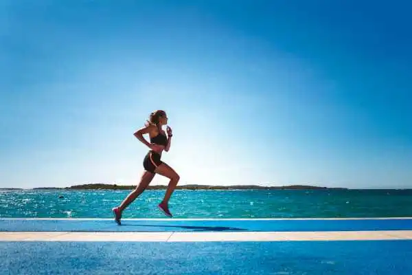 Woman running showing strong leg muscle Soham